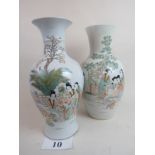 A matched pair of fine quality Chinese famille verte vases on a white grounds,