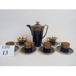 A Crown Devon Modane Art Deco coffee set, decorated in gilt over rich blue, to include, coffee pot,