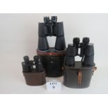 Three pairs of binoculars, comprising Denhill 20 x 65, Helles of Paris 10 x 50,