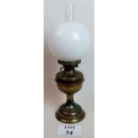 Brass oil lamp with frosted shade,