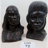 A pair of carved wooden busts hand carve