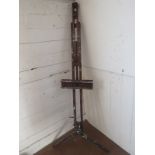 A large vintage artist's studio easel, a