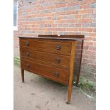 An Edwardian inlaid mahogany chest of th