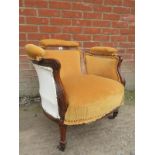 An Edwardian inlaid tub chair terminatin