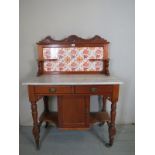 A 19th mahogany wash stand with a raised