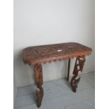 A decorative Eastern side table with a c