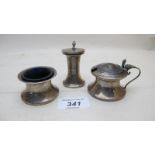 A 3 piece silver condiment set with blue