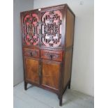 A 20th Century Chinese hardwood cupboard