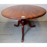 A Victorian mahogany circular low table