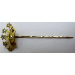 A crown shaped stick pin with six diamonds and two rubies est: £100-£150
