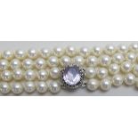 A 2 strand pearl necklace with amethyst clasp,