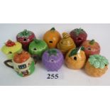 Eleven novelty ceramic preserve jars and covers,