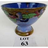 Doulton Art Pottery pedestal bowl, with flowers in relief on a blue ground,