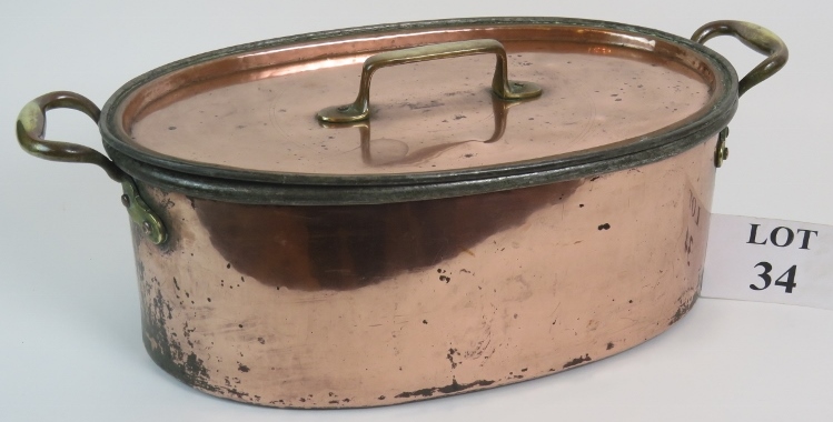 Large copper pan with brass handles, steel interior and fitted strainer,