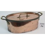 Large copper pan with brass handles, steel interior and fitted strainer,