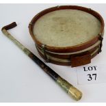 A swagger stick marked Pledge & Sons 1918, carved from bone and a snake drum with wooden frame,