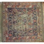 A late 19th/20th century Persian square rug, (worn),