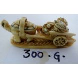 A Japanese Meiji period carved ivory okimono (two piece),