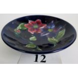 A Moorcroft bowl, tapered circular form terminating on a foot,