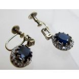 A pair 9ct gold screw back earrings, set with centre sapphire, 7mm x 9mm, surrounded by diamonds,