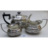 A 3 piece silver tea service, comprising of teapot,