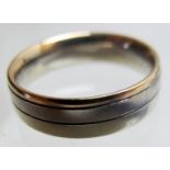 An 18ct three coloured gold wedding ring, size M, approx 6.