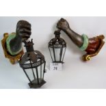 Pair of antique/vintage polychrome wall lights in the form of arms holding the lanterns, 46cms long,