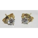 A pair of 15ct gold diamond stud earrings, approx 0.