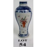 A 19th century Chinese export vase with blue and white border and a central polychrome floral spray,