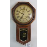 A 19th century American mahogany cased drop-dial wall clock by The Ansonia Clock Company of New