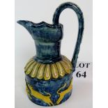 Castle Hedingham pottery jug, with raised decoration of yellow wolves on a blue ground,