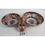 Two Japanese Imari porcelain bowls, c.1900, and a Japanese Kutani bottle vase, c.