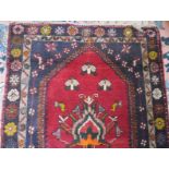 A thick pile Kalardasht (Caspian) rug open claret field with rare geometric and bird/duck motifs,