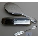 A silver engraved butter knife, Birmingham 1897, and a silver backed hair brush & clothes brush,