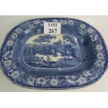 A 19th century blue and white transfer printed meat platter with gravy well and veins,