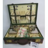 A good quality vintage brass bound leather finished picnic hamper,