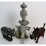 Three pieces of contemporary African Tribal Sculpture, comprising a carved stone group signed P.