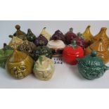 A collection of 19 novelty ceramic face pots and lids, including Sylvac,