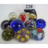 Ten 20th century glass paperweights, including Wedgwood, Webb, etc,