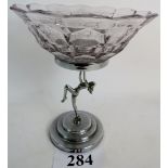 An Art Deco chrome and glass pedestal bowl, with dancing naked female support,