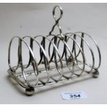 A Georgian silver toast rack, Sheffield 1824,