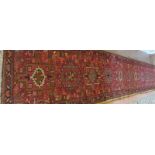 A mid 20th century Persian Hamadan runner (418 cm x 73 cm approx) est: £300-£400