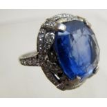 A platinum ring inset with large Ceylon sapphire 18mm x 16mm and surrounded with 2 bands of