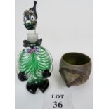 A hand blown glass decanter in the form of a clown in a Murano glass style and a Poole Pottery vase