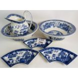 A selection of old blue and white 'willow' pattern china, comprising a jug, 2 basins,