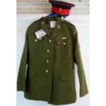 A vintage Army tunic, trousers and cap, with various buttons and badges.