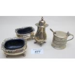 A three piece silver condiment set, comprising of two salts with blue liners and pepper,