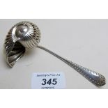 An unusual silver shell shaped sifter spoon,