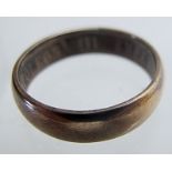 A yellow metal ring, possibly French gold with inscription "Napoleon III Empereur 1857",