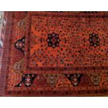A fine quality Persian rug on burnt amber field,